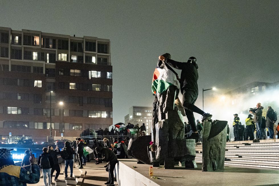 Pro-Palestinians demonstrate at Amsterdam's Anton de Komplein square ahead of the UEFA Europa League football match