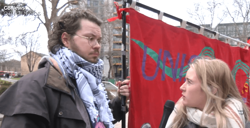 Pro-trans protester speaking to Connie Shaw
