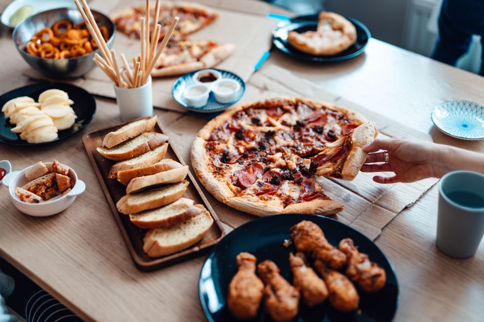 Processed foods including pizza and garlic bread