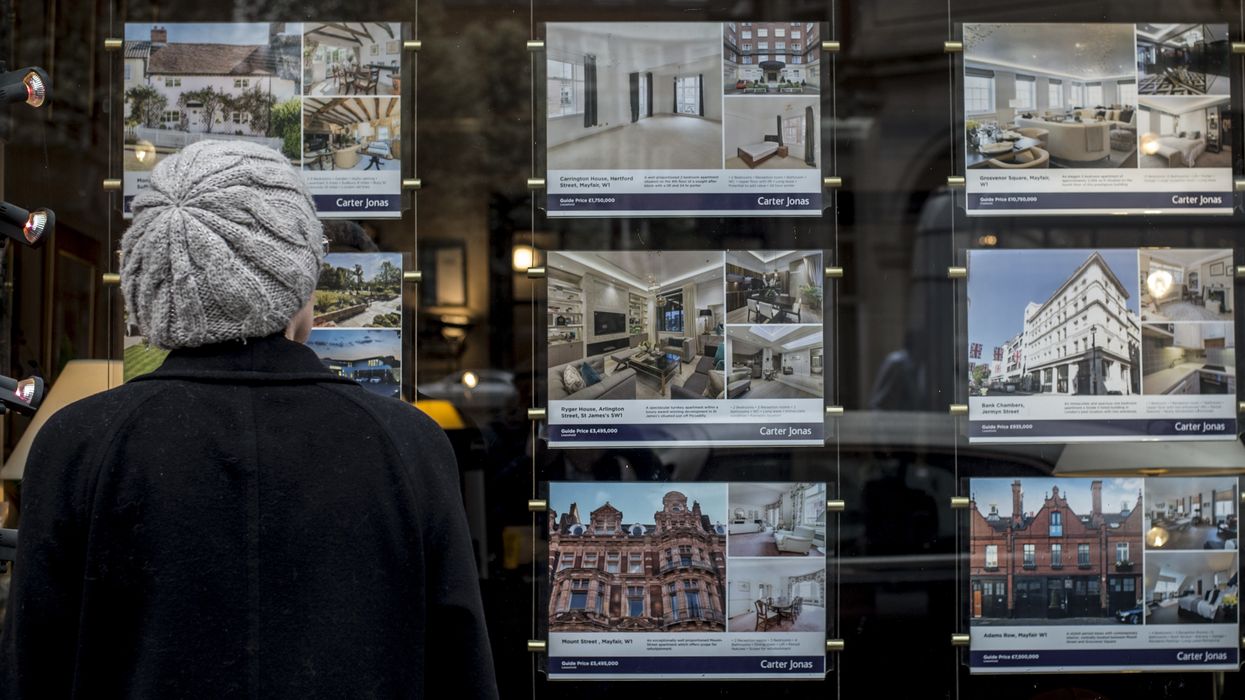 Property for sale in window of estate agents
