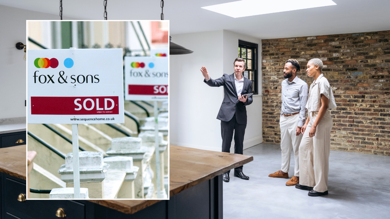 Property for sale sign / estate agent doing viewings