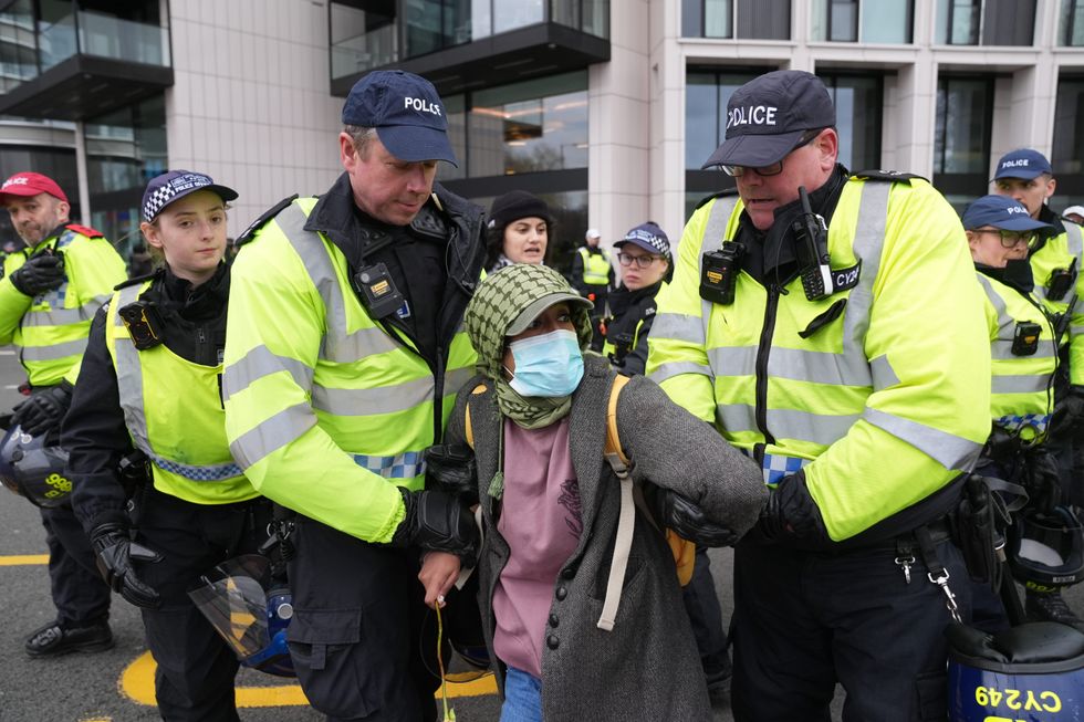 Protester being arrested by police