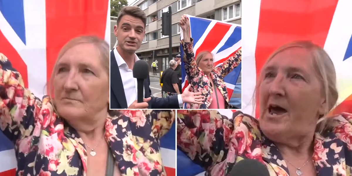 NextImg:Moment courageous Briton proudly holds Union Jack flag aloft in front of mask-clad Antifa protesters