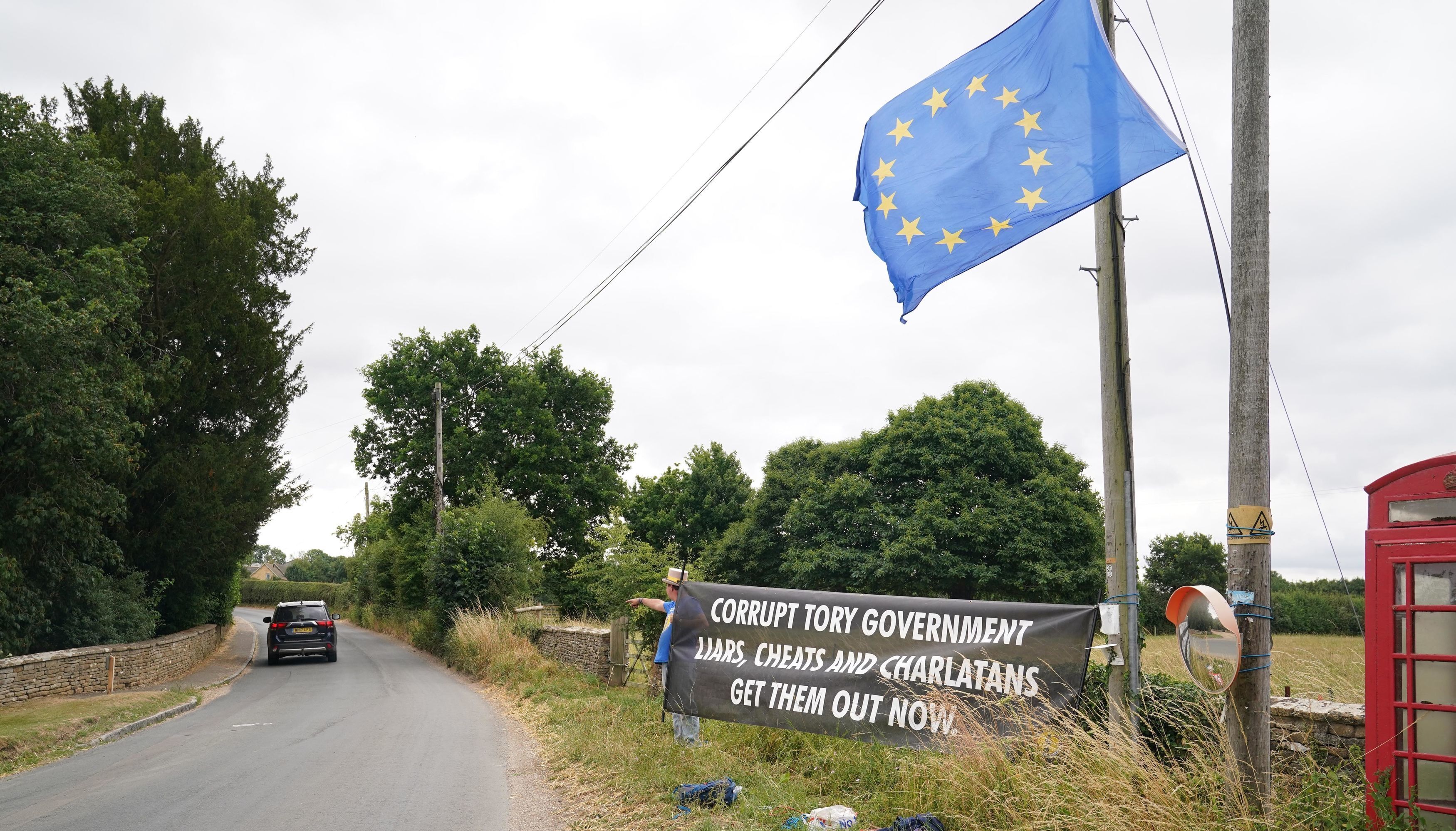 Protester Steve Bray demonstrates near Daylesford House in Gloucestershire, where Prime Minister Boris Johnson and wife Carrie are held a first wedding anniversary party for friends and family