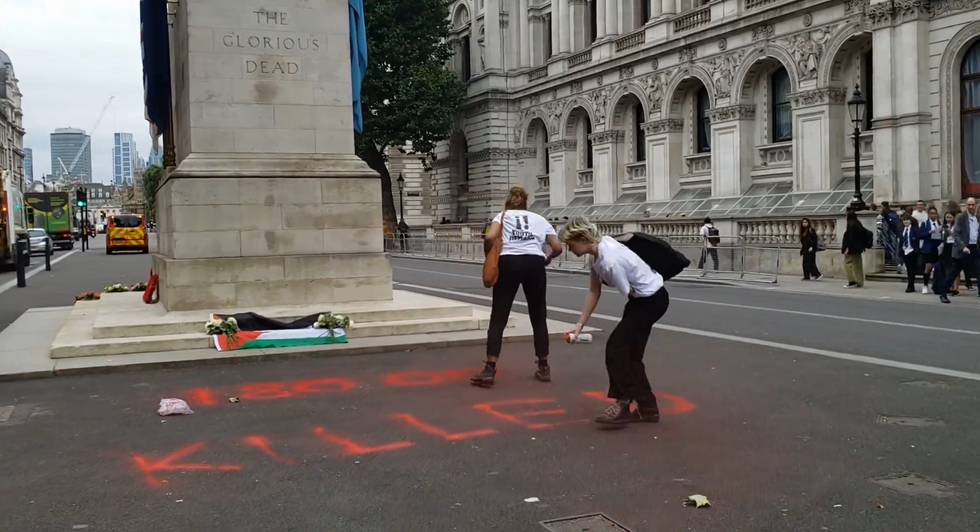 Protesters also painted writing on the road with spray paint