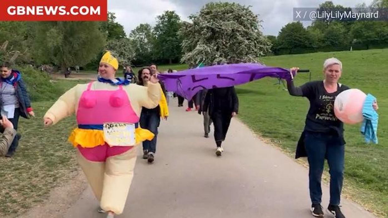 Women storm men's only natural bathing pond in fake beards in protest over chiefs failing to ban trans swimmers