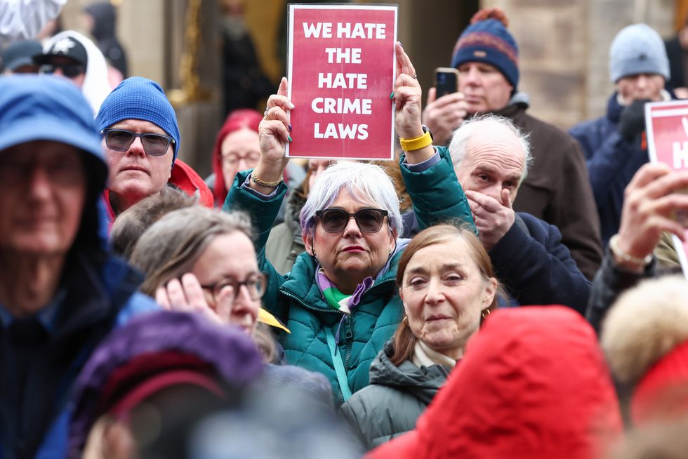 Protesters demonstrate outside the Scottish Parliament as Scotland\u2019s Hate Crime Law comes into force