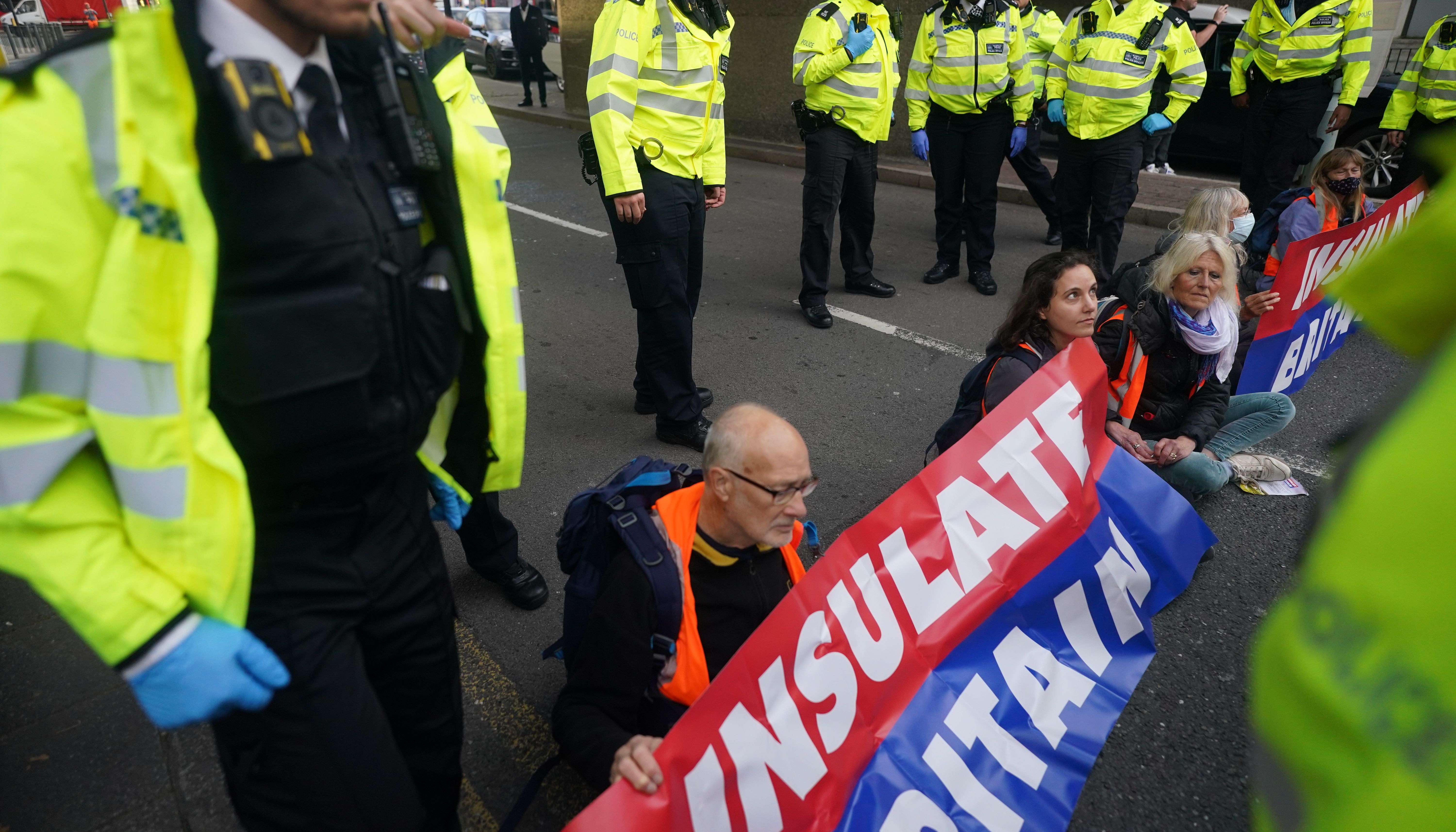 Protesters from Insulate Britain blocking a road near Canary Wharf in east London.