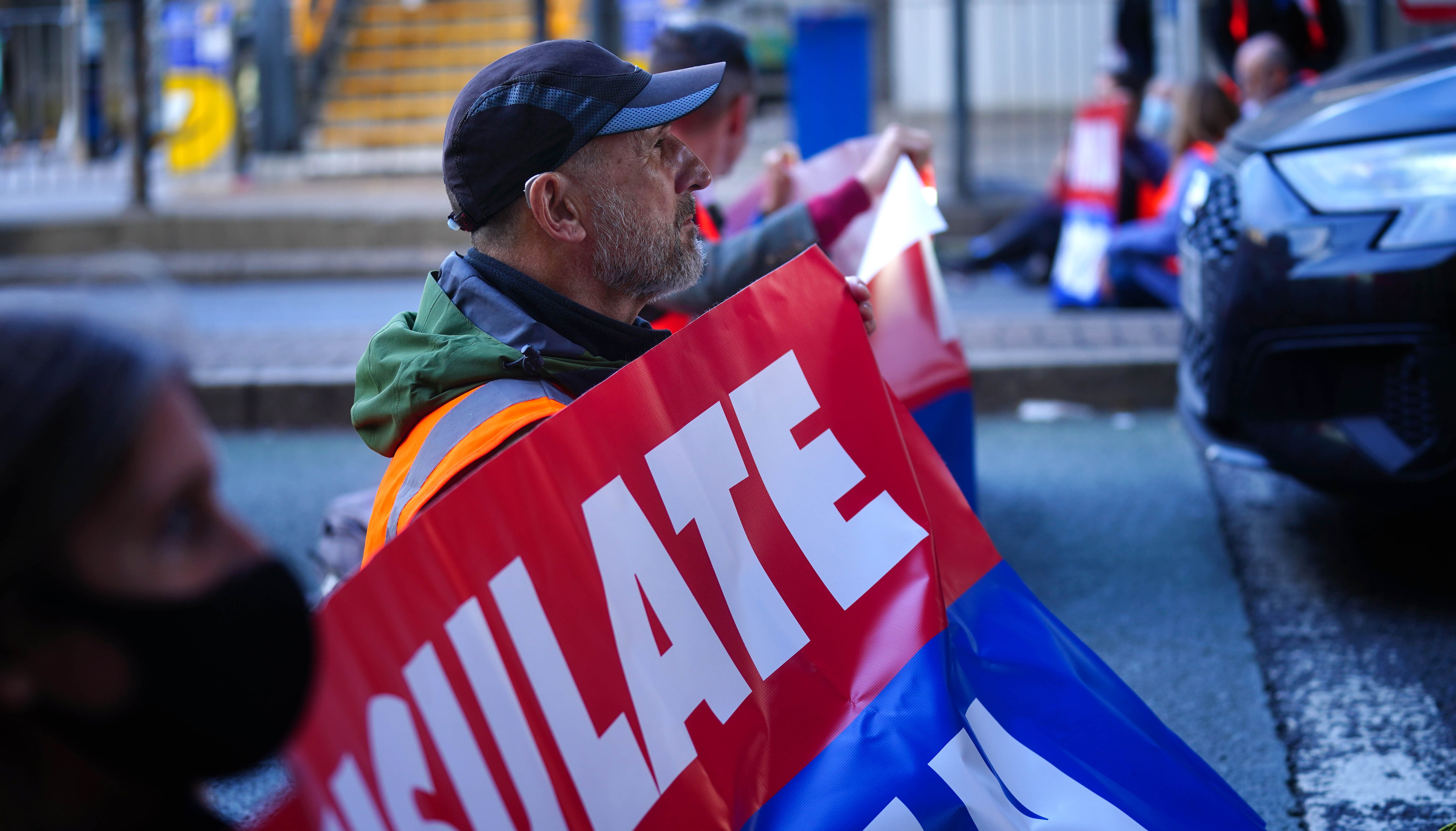 Protesters from Insulate Britain blocking a road near Canary Wharf in east London.
