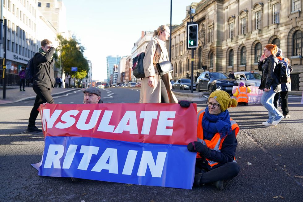 Protesters from Insulate Britain blocking Great Charles Street Queensway in Birmingham.