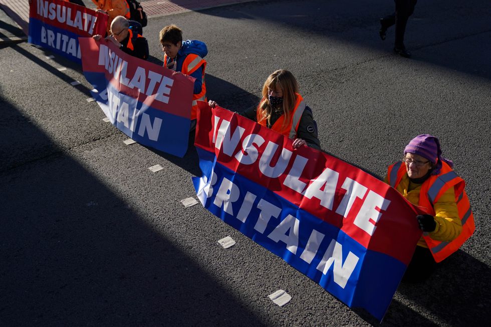 Protesters from Insulate Britain blocking Great Charles Street Queensway in Birmingham.