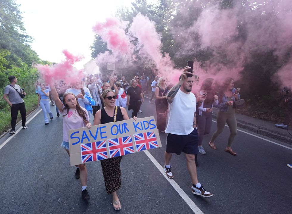 Protesters gather in Epping outside a migrant hotel