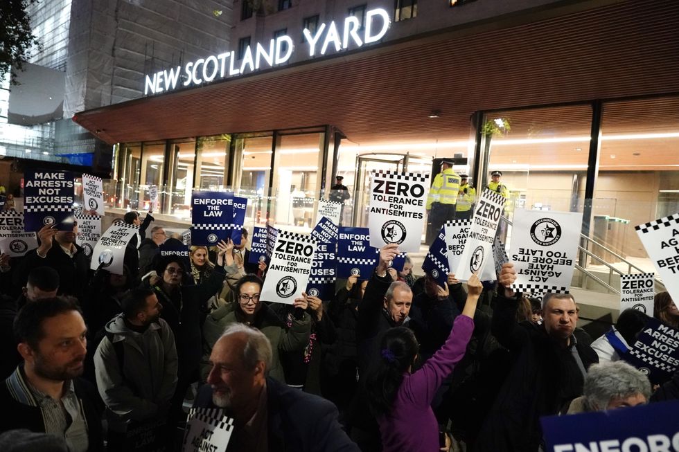 Protesters gather outside New Scotland Yard to call on the Metropolitan Police to do more