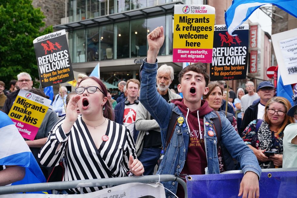 Protesters gather outside Perth Concert Hall in Perth, Scotland, where Conservative leadership hopefuls, Liz Truss and Rishi Sunak are due to take part in an hustings event. Picture date: Tuesday August 16, 2022.