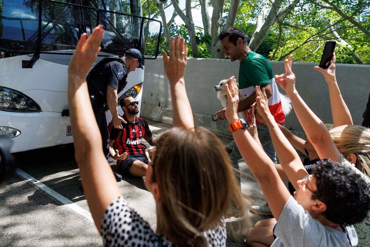 Protesters have blocked the bus with the Iranian women's football team