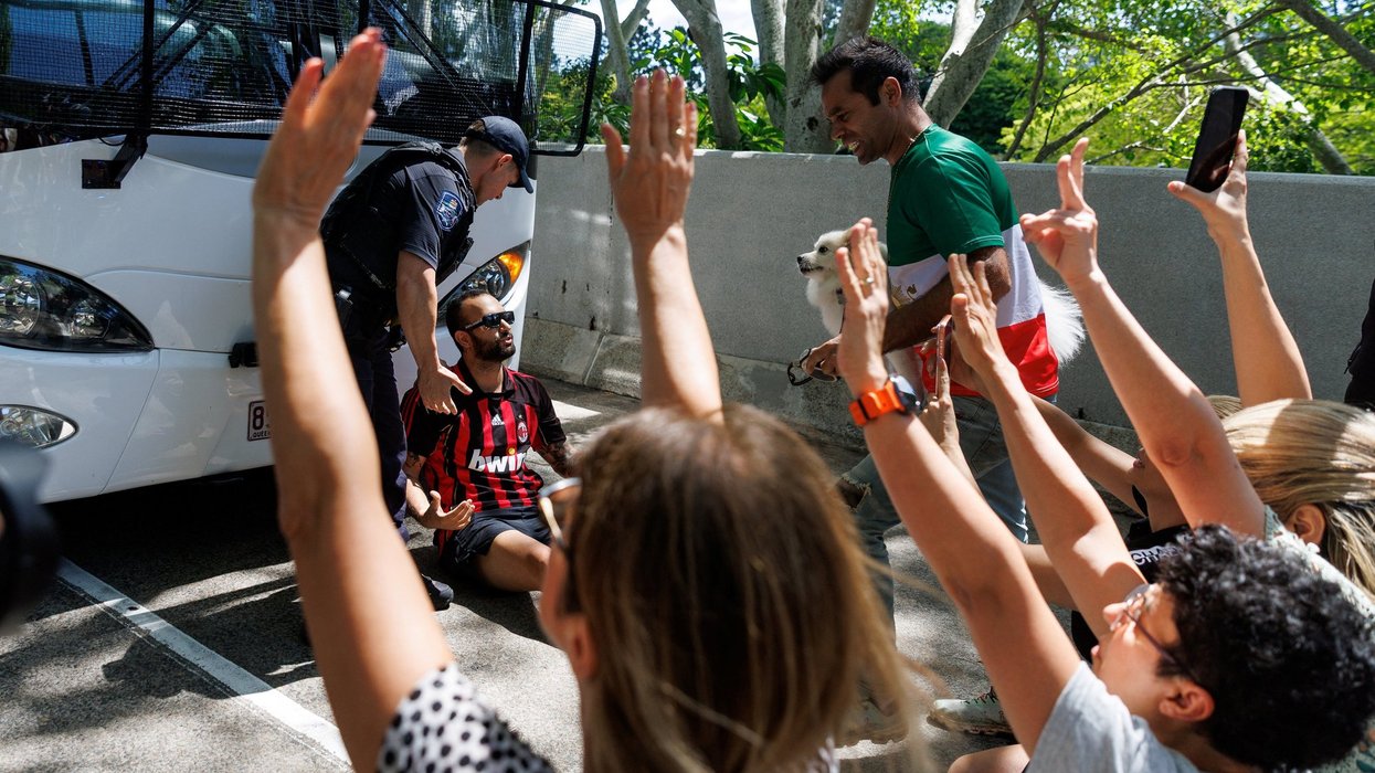Protesters have blocked the bus with the Iranian women's football team