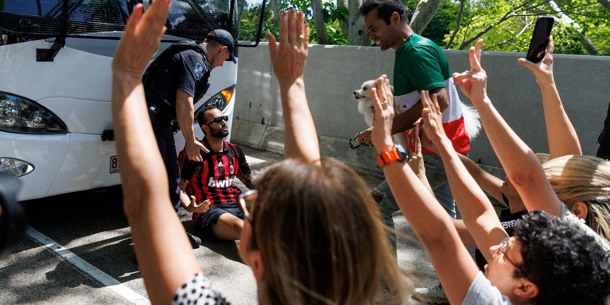 Protesters attempt to blockade Iranian soccer team from leaving Australia hotel Protesters attempt to blockade Iranian soccer team from leaving Australia hotel