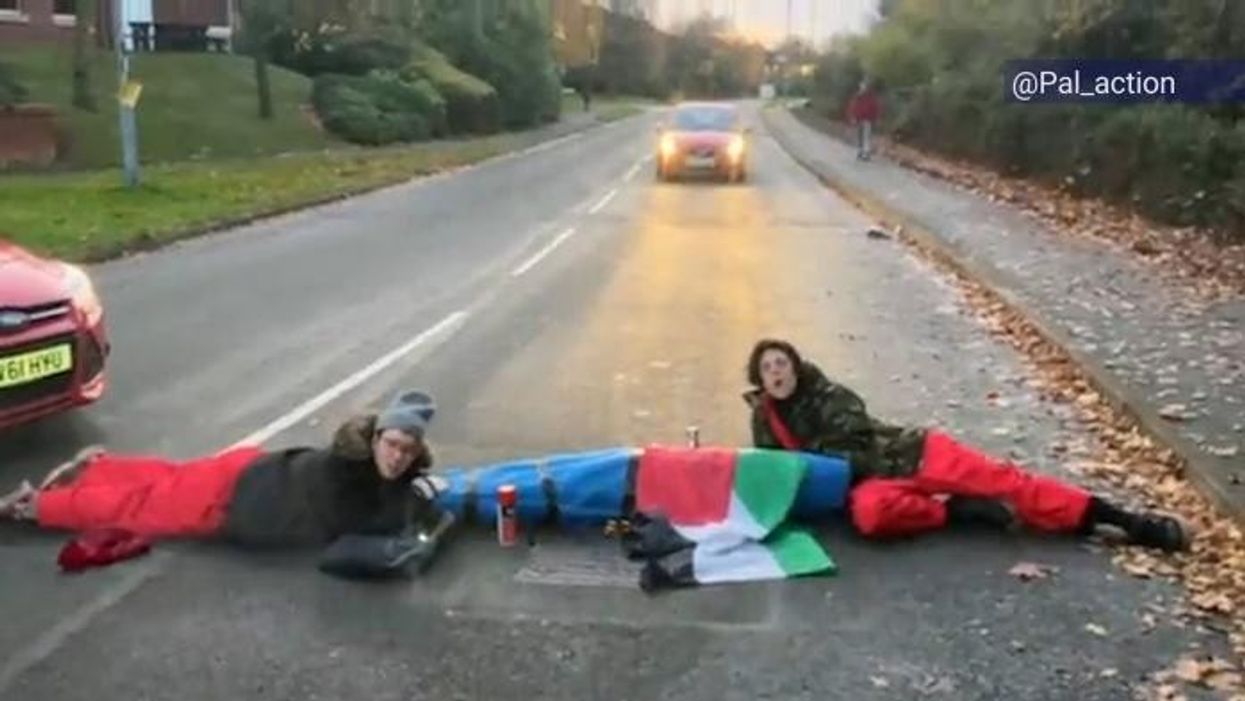 Palestine protesters lock together to block road in Leicester as factory workers barred from going to work