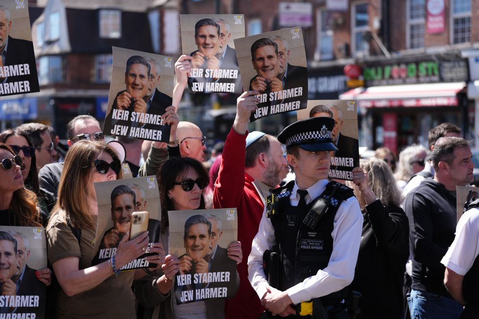 Protesters holding placards against Prime Minister Sir Keir Starmer in Golders Green