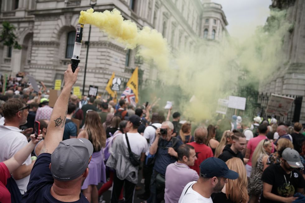 Protesters let off flares outside Downing Street during an anti-lockdown protest in central London earlier this year.