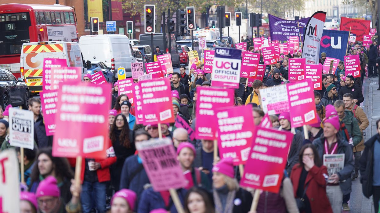 Protesters marching during a rally as members of the University and College Union (UCU) strike