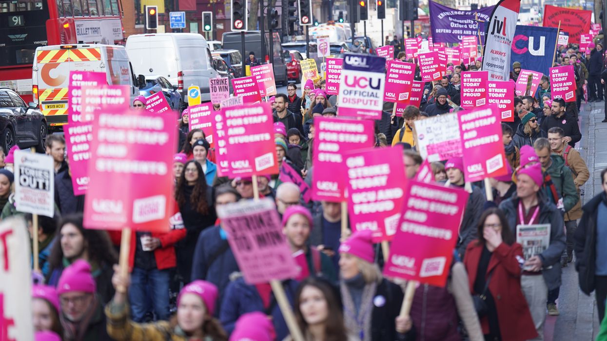 Protesters marching during a rally as members of the University and College Union (UCU) strike