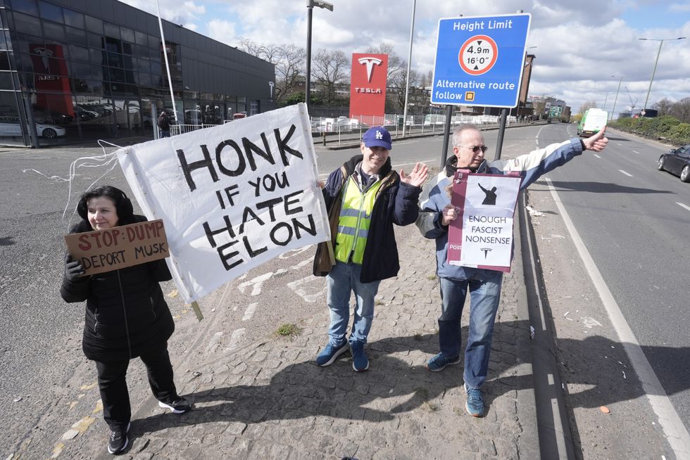 Protesters outside a Tesla dealership in London