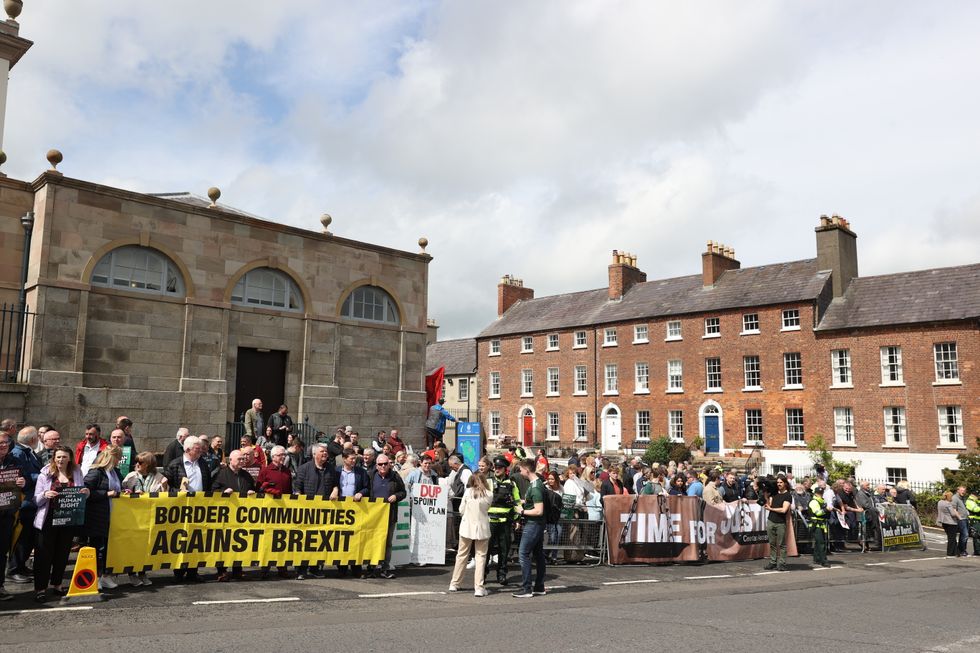 Protesters outside Hillsborough Castle during a visit by Prime Minister Boris Johnson to Northern Ireland for talks with Stormont parties. Picture date: Monday May 16, 2022.