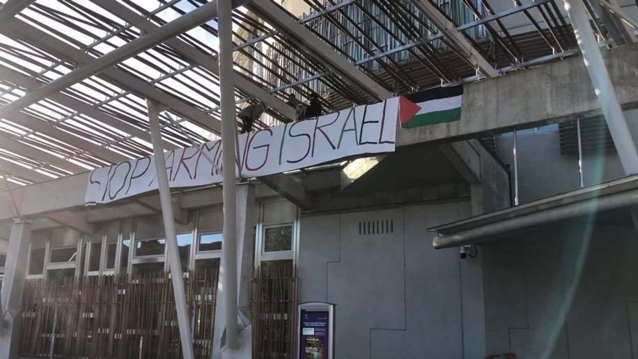 Scottish Parliament on LOCKDOWN as nuisance Palestine protesters scale roof and unveil banner