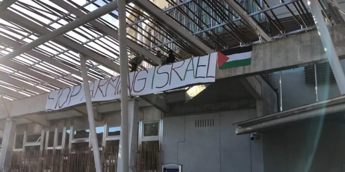 NextImg:Scottish Parliament on lockdown as Palestine protesters scale roof and unveil banner