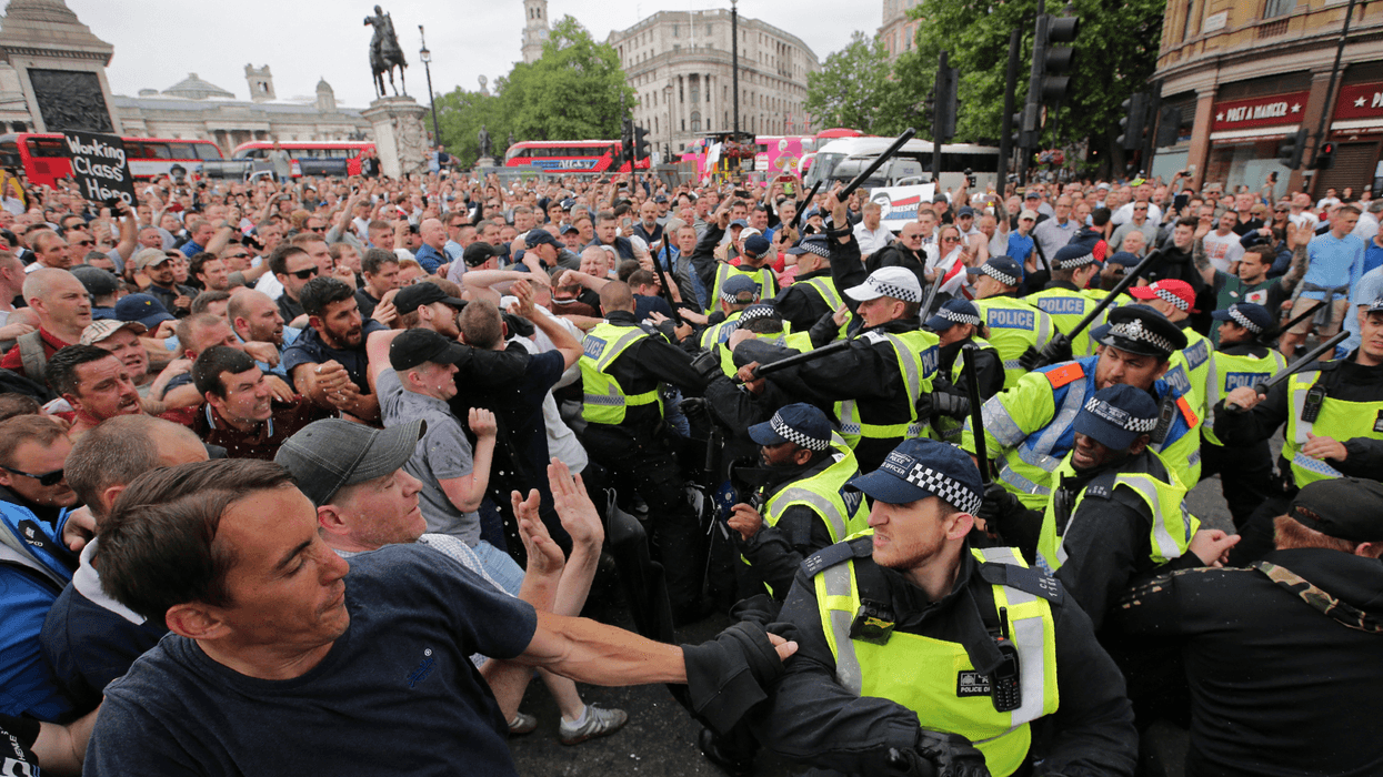 Protesters scuffle with police at the junction of Whitehall and The Mall