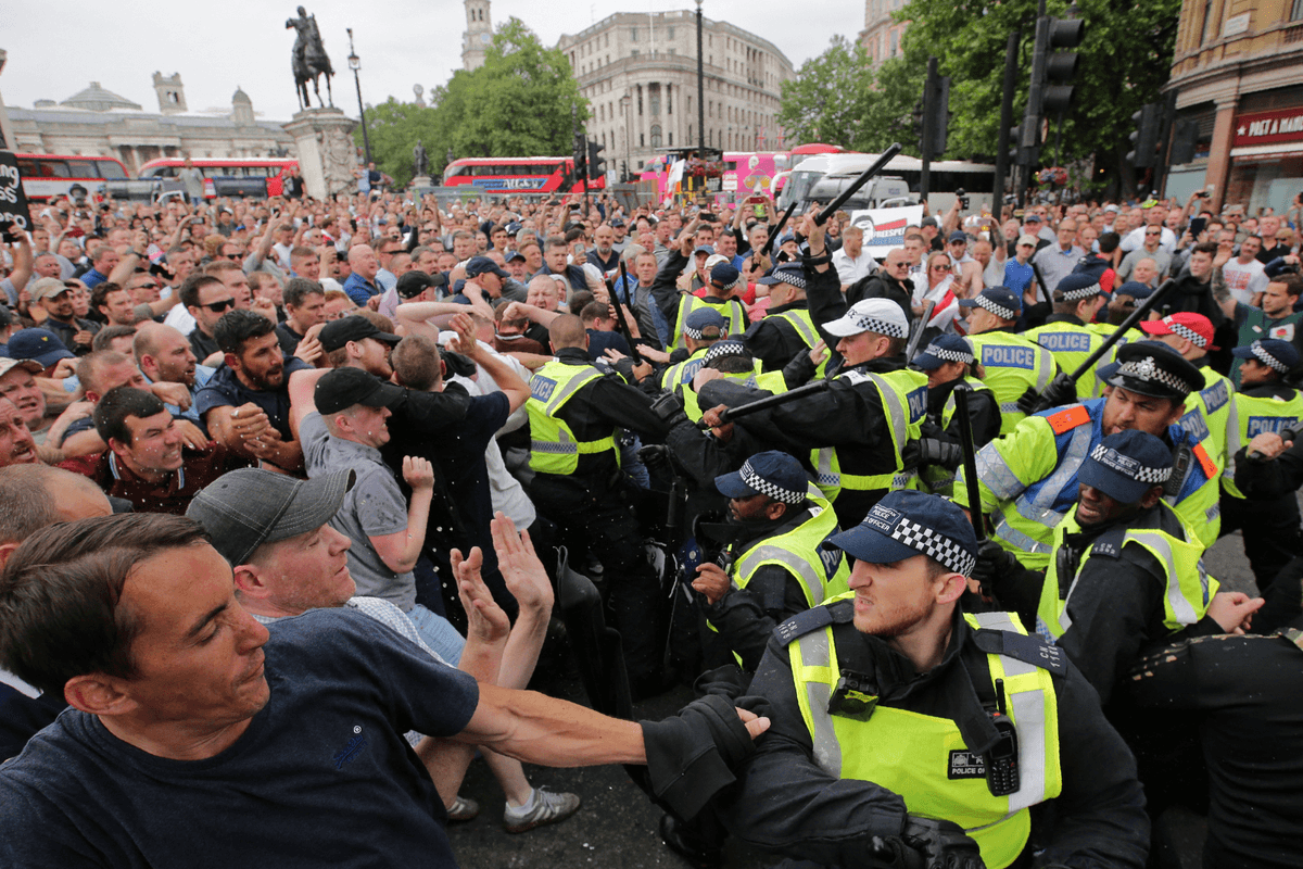 Protesters scuffle with police at the junction of Whitehall and The Mall