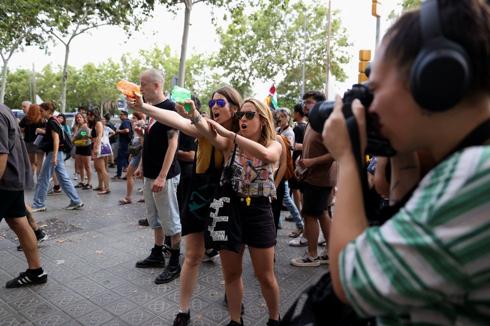 Protesters spraying water