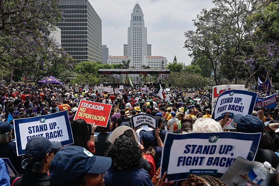 Protesters were seen holding up signs stating 'stand up, fight back'