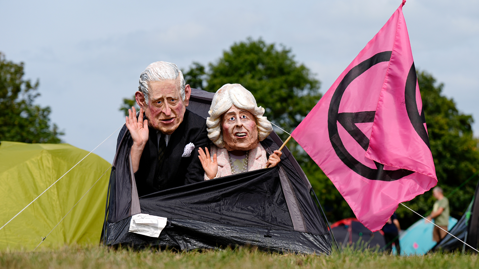 Protesters with Charles and Camilla masks