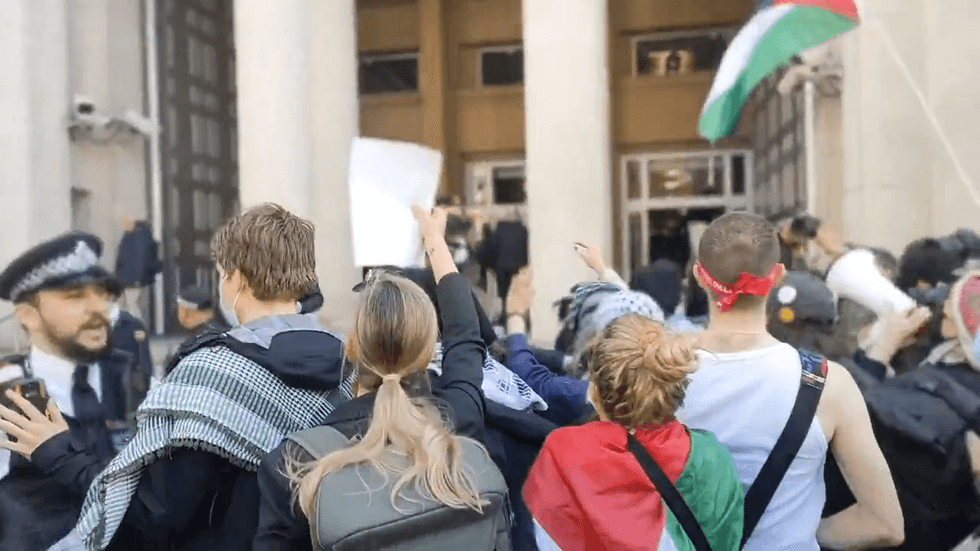 Protestors clash with police outside MoD