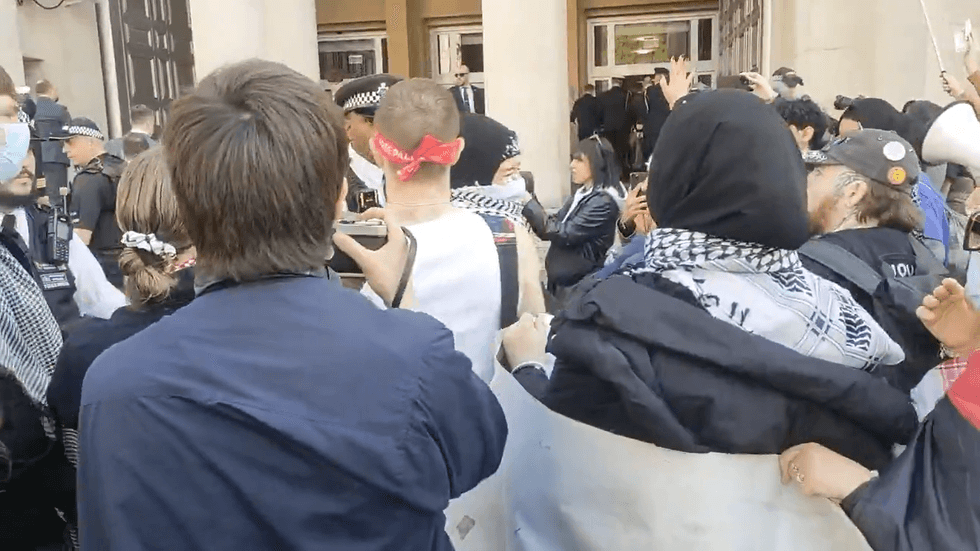 Protestors clash with police outside MoD