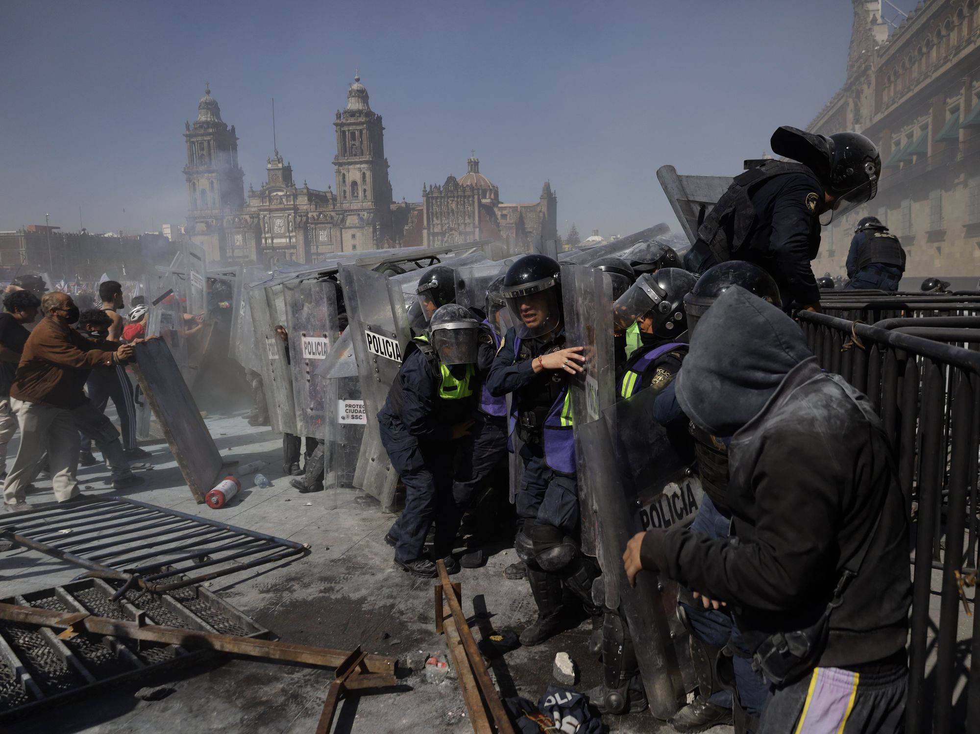 Protestors clash with riot police in Mexico City