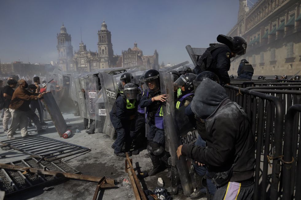 Dozens injured after thousands of protesters clash with police amid anti-government protests in Mexico