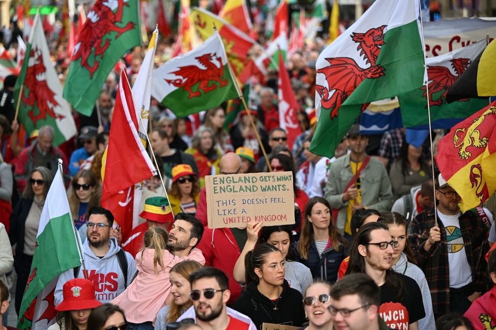 Protestors walk through Queen Street during a march in support of Welsh Independence