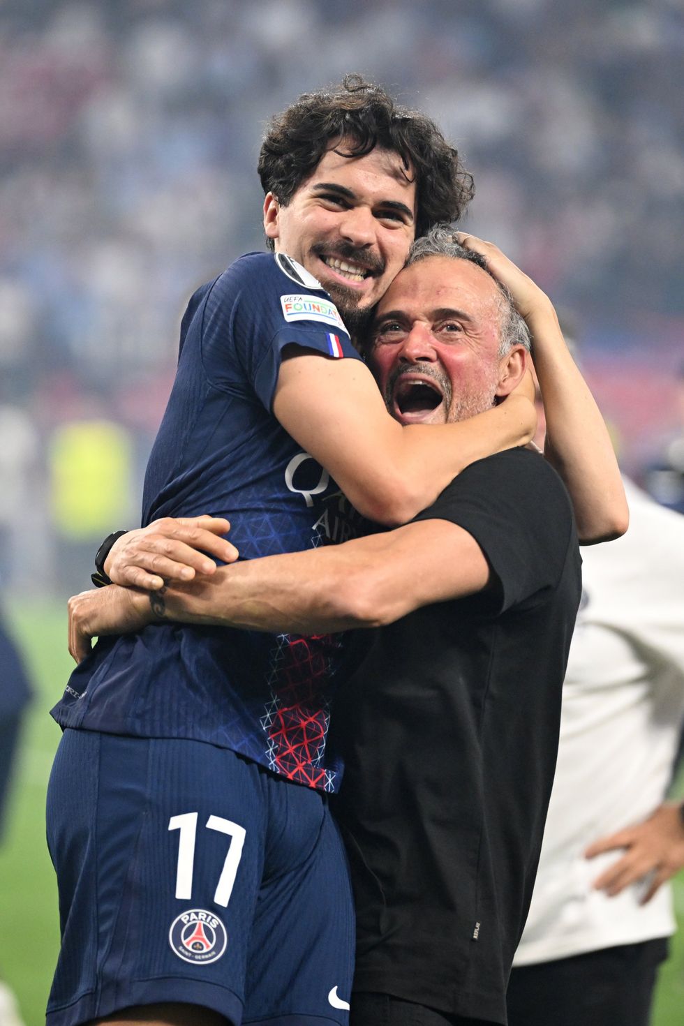 PSG boss Luis Enrique celebrates with Vitinha after their Champions League final win over Arsenal