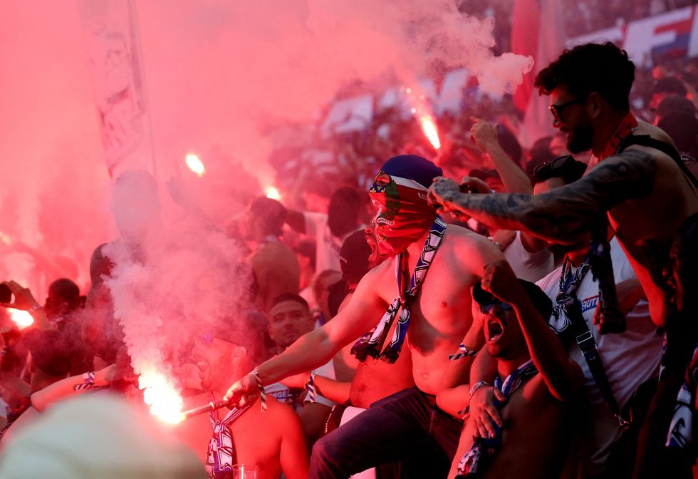 PSG fans clashed in their own end at the Puskas Arena during their Champions League final against Arsenal