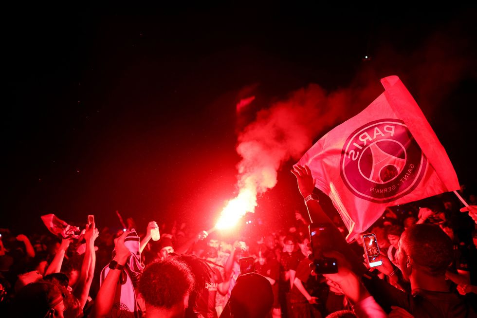 PSG fans partied into the night as riot police clashed with crowds around the city