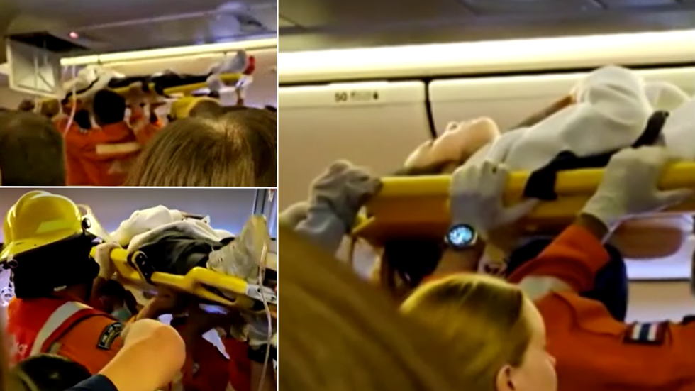 Pssengers being stretchered out of flight