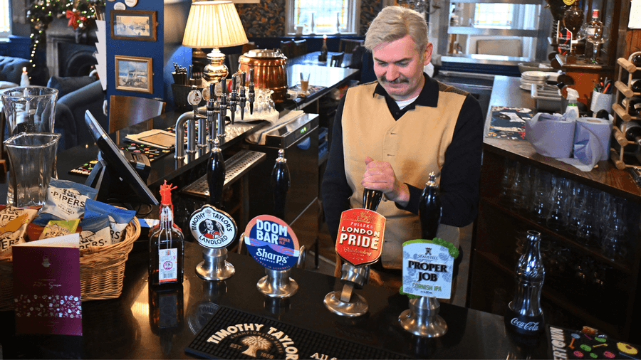 Pub landlord pouring a pint