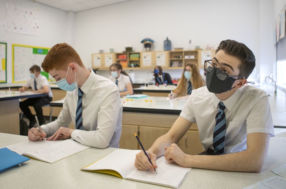 Pupils at St Columba's High School in Gourock, Inverclyde, wear protective face masks during their chemistry lesson.