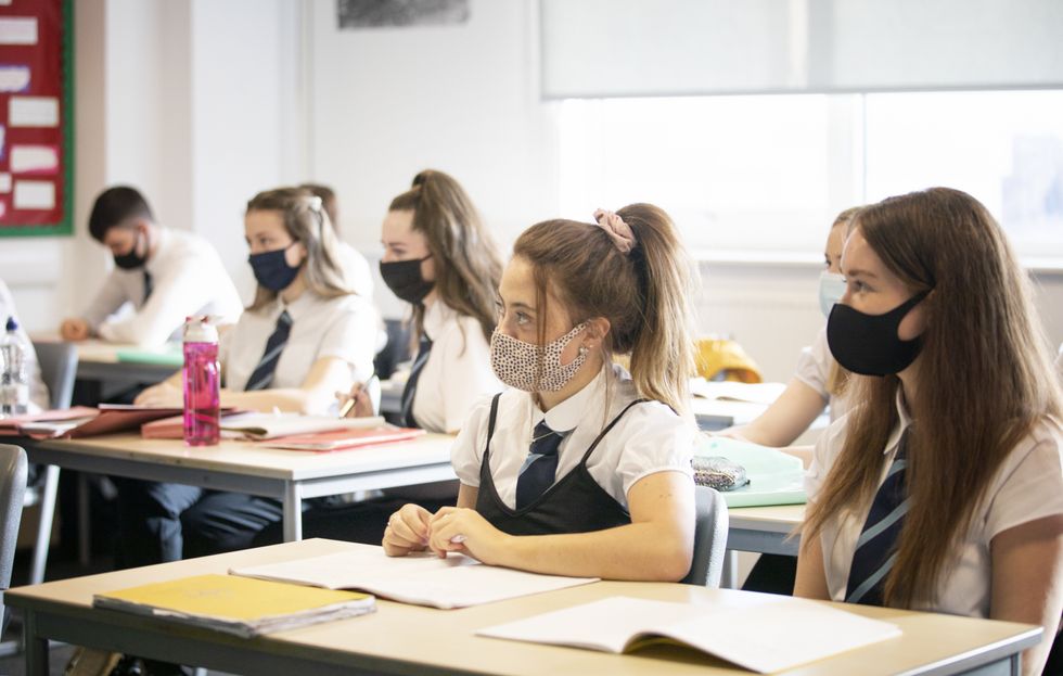 Pupils at St Columba's High School in Gourock, Inverclyde, wear protective face masks during their history lesson.