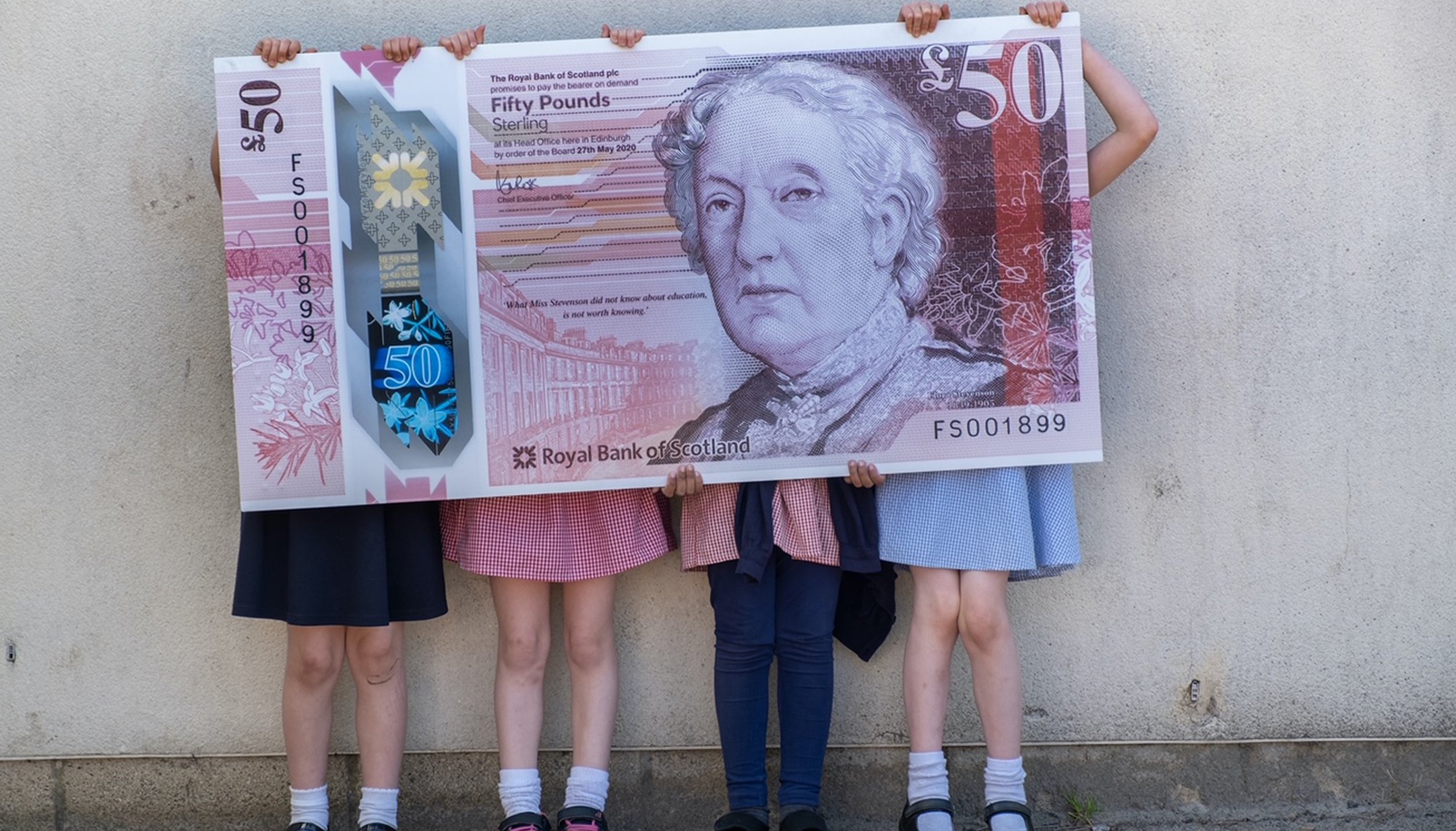 Pupils from Flora Stevenson Primary School in Edinburgh with the new 50 note which features an illustration of Scottish education pioneer Flora Stevenson.