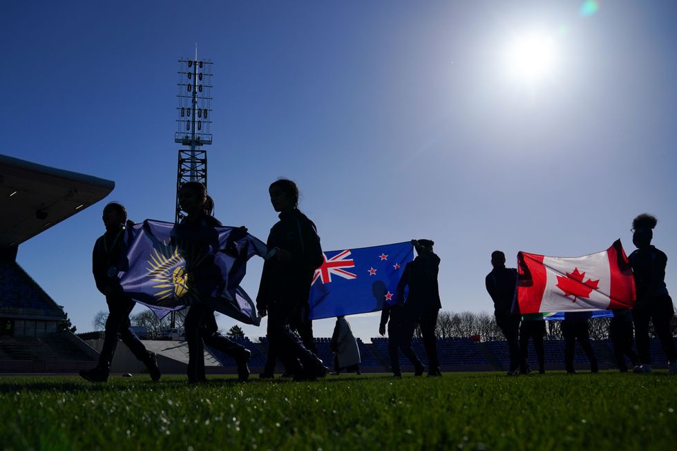 Pupils from schools in Birmingham carry the Commonwealth flag as well as member nations flags as they celebrate Commonwealth Day at the Alexander Stadium, the venue for the Opening/Closing Ceremonies and the athletics programme for the Commonwealth Games which will begin on 28 July 2022. Picture date: Monday March 14, 2022.