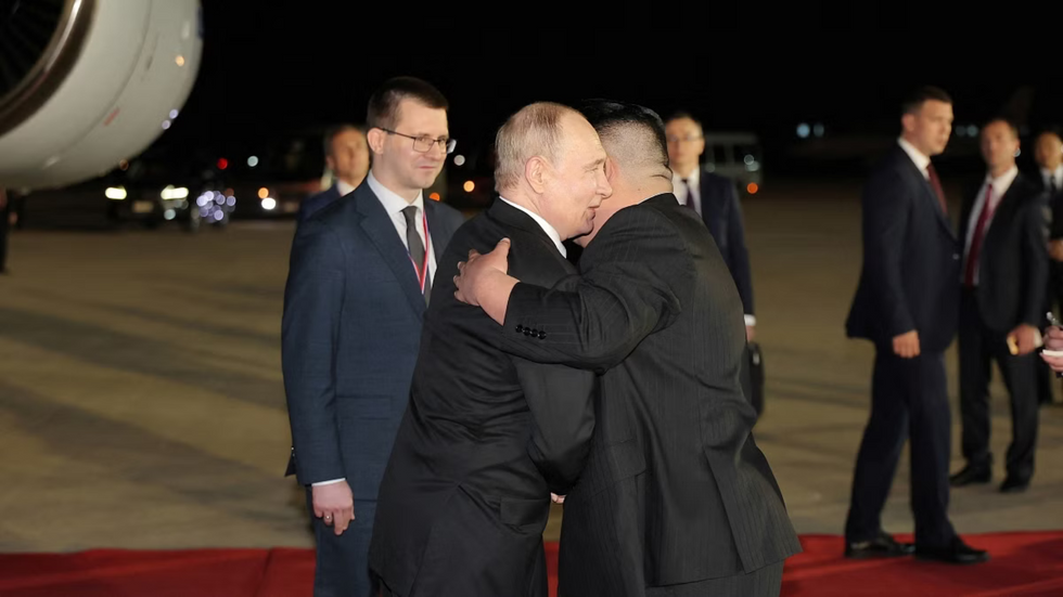 Putin and Kim Jong-un hugging